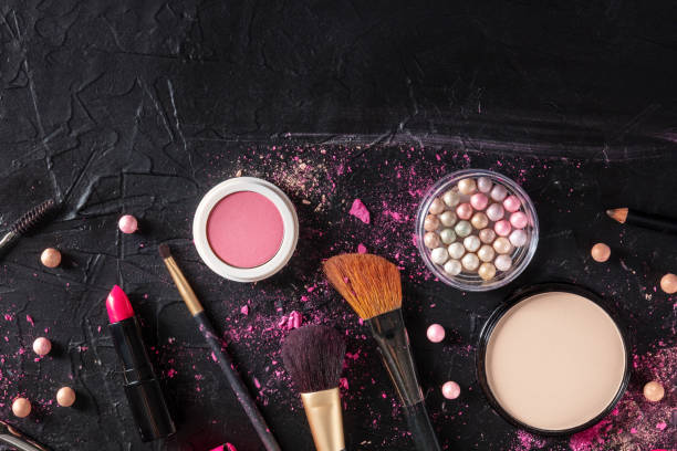 istock Make up products and tools, overhead flat lay shot on a black background 1299720763