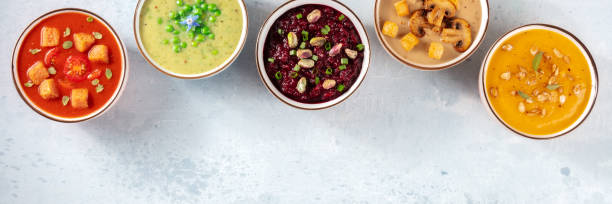 istock Vegan soup panorama with a place for text. Various vegetable cream soups 1299721026