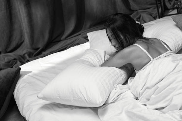 istock beautiful young woman sleeping in her bedroom 1299724868