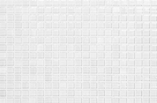 istock White or gray ceramic wall and floor tiles abstract background. Design geometric mosaic texture decoration of the bedroom. Simple seamless pattern for backdrop hospital wall, canteen and grid paper. 1299725910