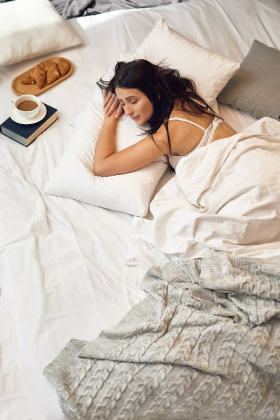istock beautiful young woman sleeping in her bedroom 1299725924