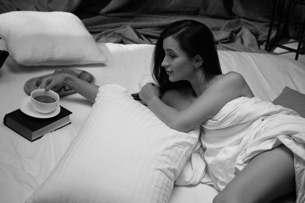 istock beautiful young woman drinking her tea 1299725960