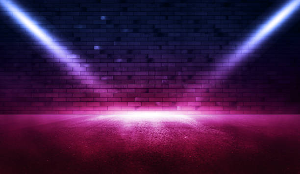 istock Rays neon light on neon brick wall with wet asphalt. Empty scene. Copy space 1299726491