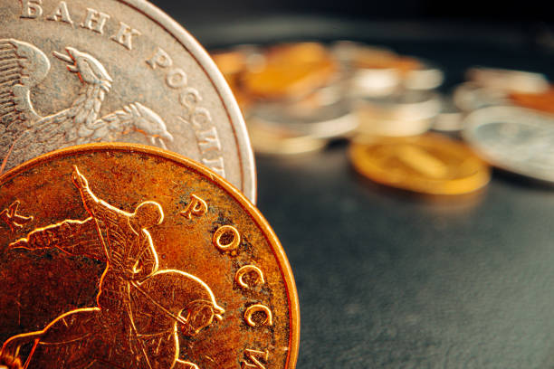 istock Russian rouble coin on dark background close up 1299727568