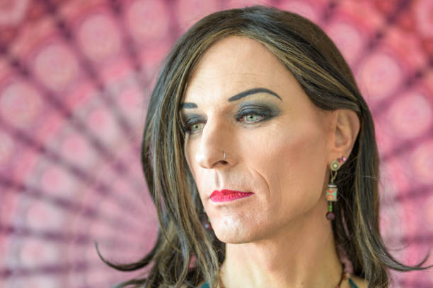 Close up portrait of a thoughtful transgender Close up portrait of a thoughtful transgender looking to the side sad gay stock pictures, royalty-free photos & images