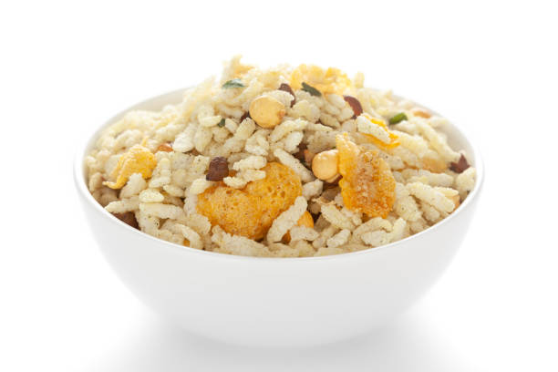 istock Crunchy Diet Mixture in a white ceramic bowl made with Puffed Rice, Corn Flakes, and Curry leaves. 1299731728