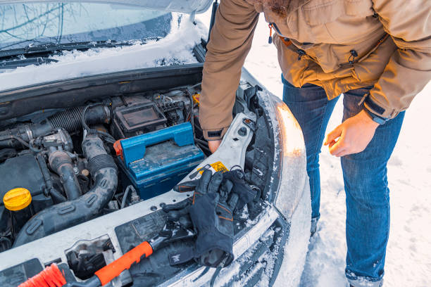 Emergency stop in winter. Car with opened car hood.