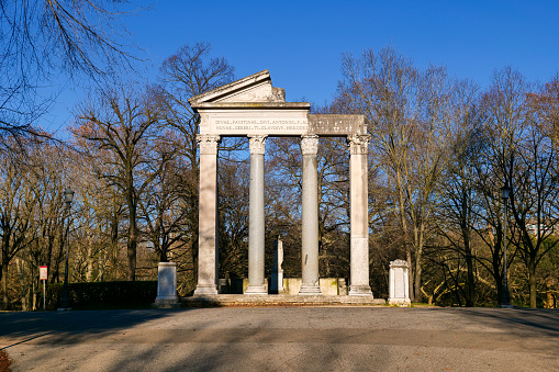 The temple of Antoninus and Faustina in the park of Villa Borghese, in the green heart of Rome near the Pincio Gardens. This temple, made up of fragments of temples from the ancient Roman Forum, was built in 1792 by the Borghese family by the architect Cristoforo Unterperger. Image in High Definition format.