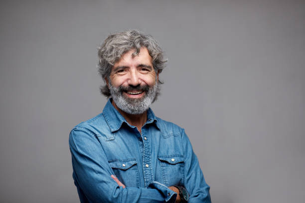 istock One Spanish senior man headshot portrait. 1299733223
