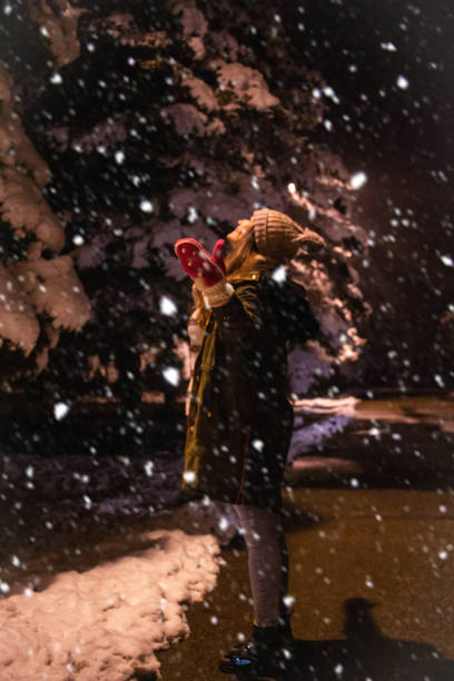 istock Beautiful woman enjoy in snow fall 1299733990