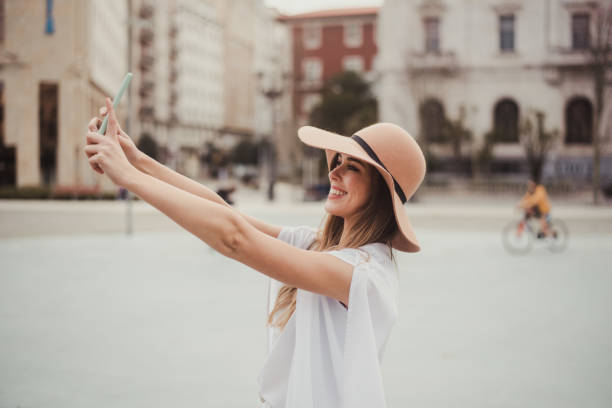 istock Young woman taking a selfie 1299734168