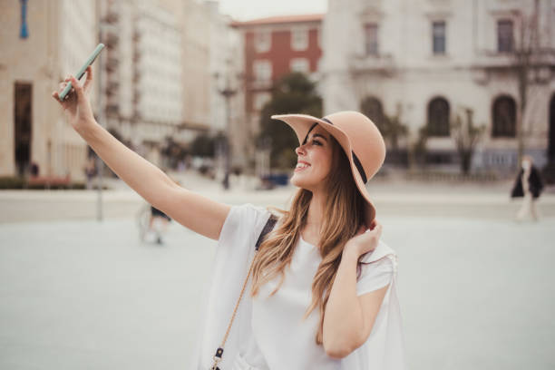 istock Young woman taking a selfie 1299734261
