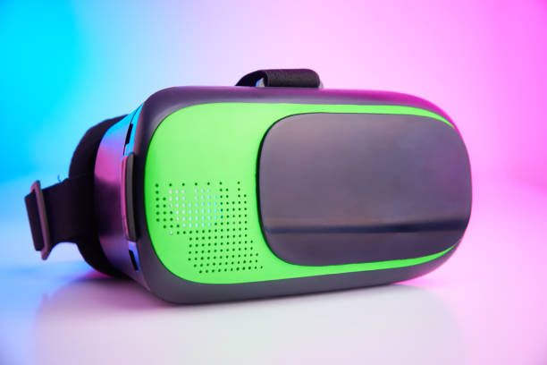 istock Virtual reality glasses on colorful background. Future technology, VR concept 1299735254