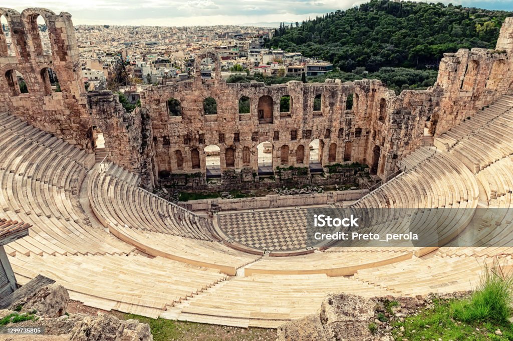 ntique open air theatre in Acropolis, Greece. The Odeon of Herodes Atticus (also called Herodeion or Herodion) is a stone Roman theater located on the Acropolis of Athens, Greece. Antique open air theatre in Acropolis, Greece. Classical Greek Stock Photo