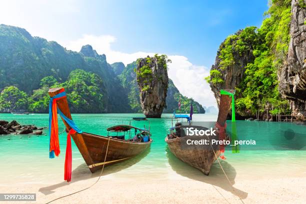 Travel Photo Of James Bond Island With Thai Traditional Wooden Longtail Boat And Beautiful Sand Beach In Phang Nga Bay Thailand Stock Photo - Download Image Now