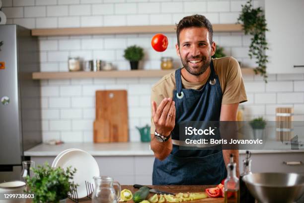Portrait Of Handsome Man In Kitchen Stock Photo - Download Image Now - Cooking, Men, Chef