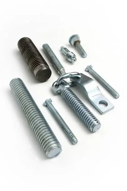 Photo of Newly manufactured large screws. Close up.