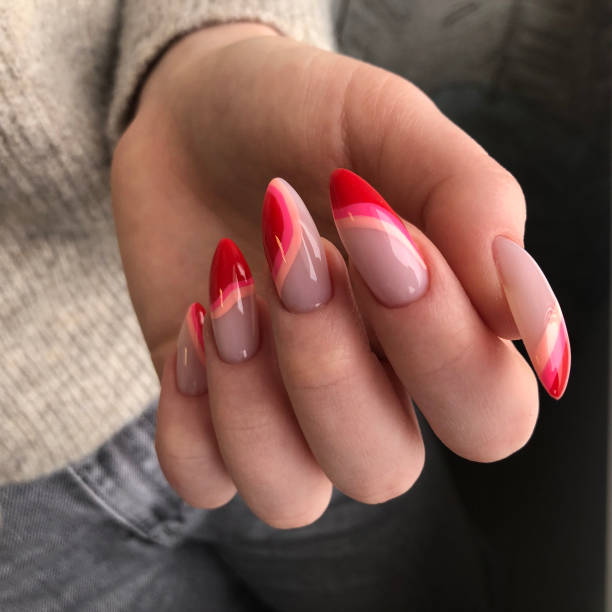 istock Bright multi-colored design of manicure.Multicolored manicure close up 1299744121