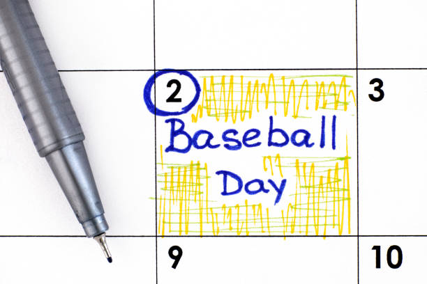 istock Reminder Baseball Day in calendar with pen. 1299744203