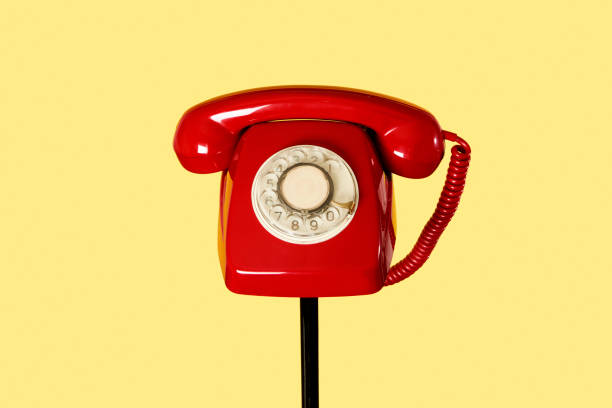 istock red rotary dial telephone on a stand 1299744555