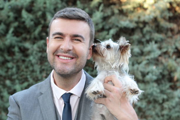 istock Stylish businessman and his Yorkshire Terrier 1299744797