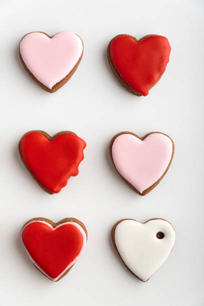 istock Gingerbread cookies with sugar icing on white background. Vertical frame 1299746179