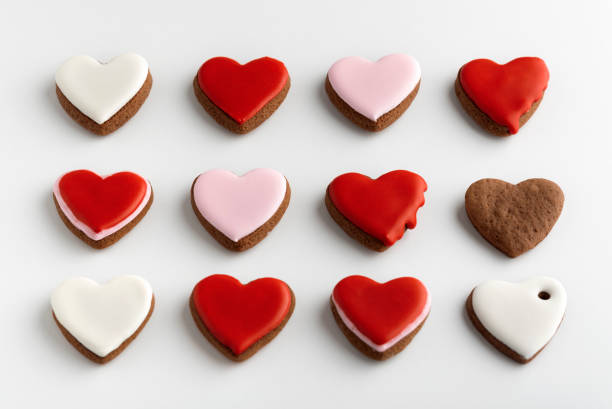 istock Background from many hearts shaped gingerbread. Valentines Day, white background. Mothers day. 1299746194