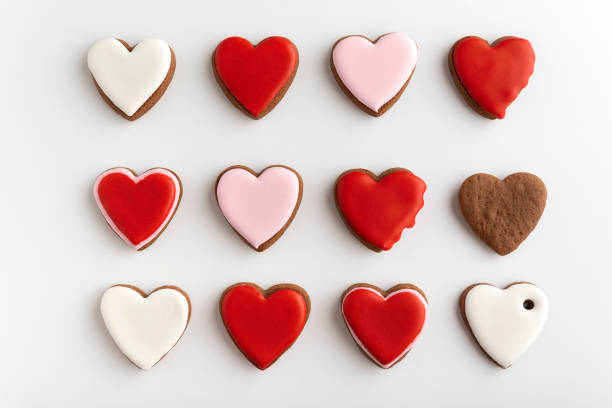 istock Background from many hearts shaped gingerbread. Valentines Day, white background. Mothers day. 1299746197