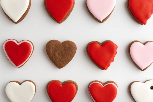 istock Background from many hearts shaped gingerbread. Close up. Valentines Day, white background. Mothers day. 1299746204