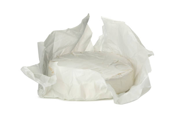 istock Delicious camembert cheese isolated on white background 1299746411