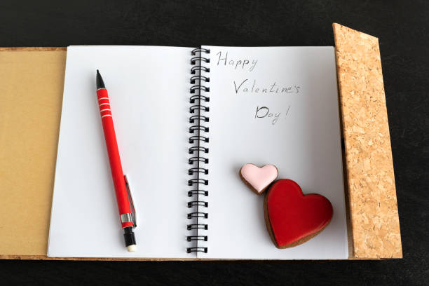 istock Notepad with inscription Happy Valentines Day. Gingerbread hearts 1299746482