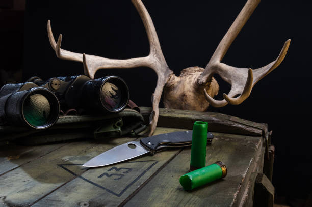 istock Hunting composition with horns, binoculars and a knife. 1299746514