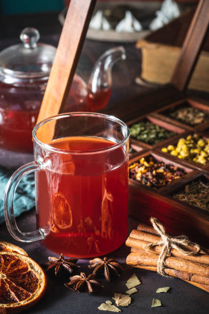 istock Red tea with a box of tea herbs and aromatic spices 1299747273