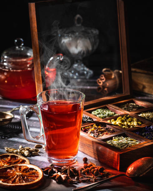istock Red tea with a box of tea herbs and aromatic spices 1299747311