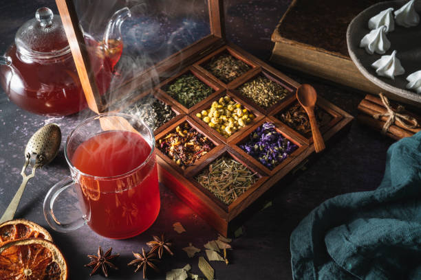 istock Red tea with a box of tea herbs and aromatic spices 1299747352