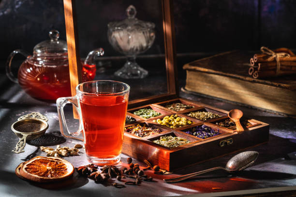 istock Red tea with a box of tea herbs and aromatic spices 1299747407