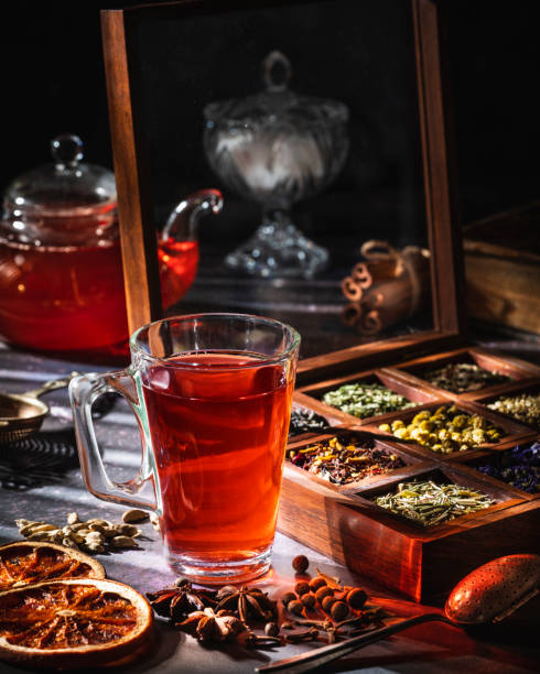istock Red tea with a box of tea herbs and aromatic spices 1299747419