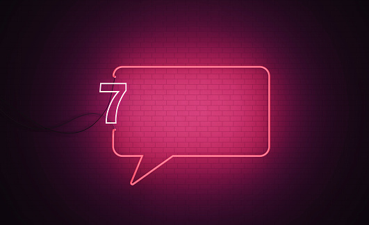 Neon colorful chat bubble. Glowing speech bubble isolated on a black background.
