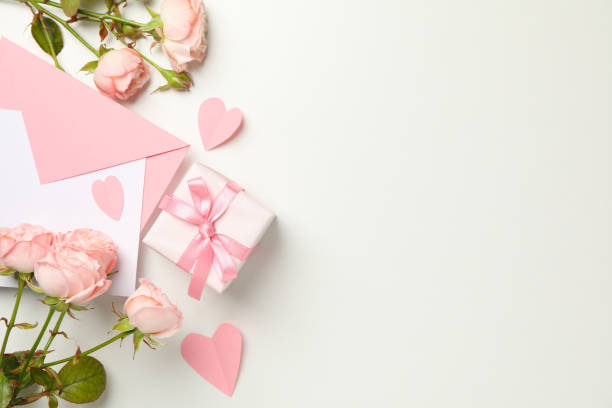 istock Envelope, roses, hearts and gift box on white background 1299747977