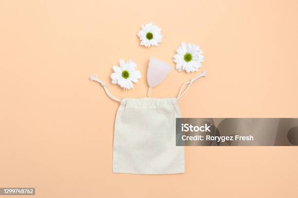 White Chamomile Flowers Menstural Cup And Canvas Sack On Yellow Background Plastic Free Concept Stock Photo - Download Image Now