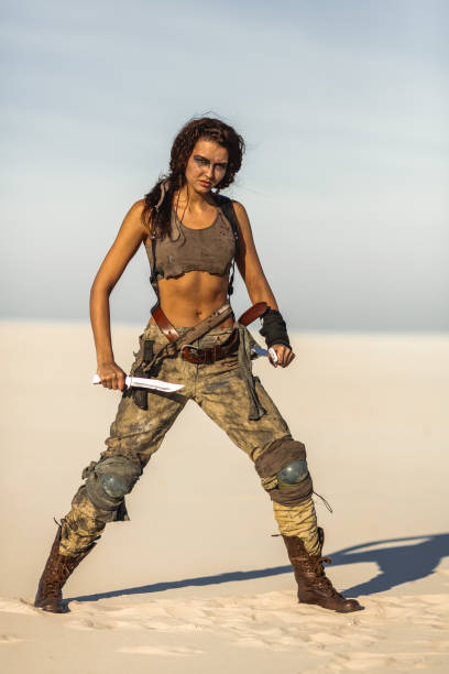 istock Post-apocalyptic Woman Outdoors in a Wasteland 1299748769