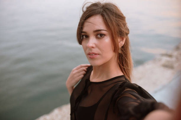 istock Young woman taking a selfie 1299748816
