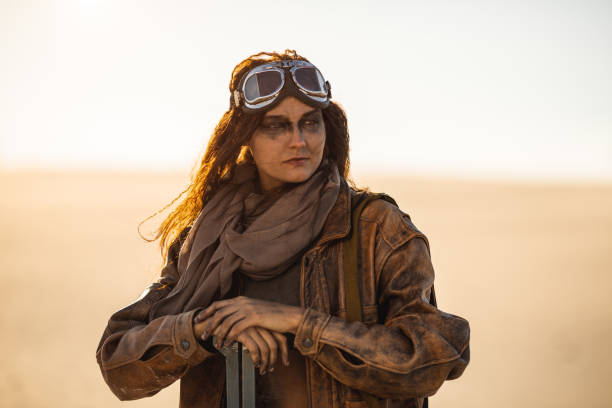istock Armed Post-apocalyptic Woman Outdoors in a Wasteland 1299749119