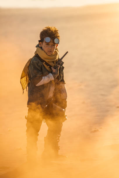 istock Post Apocalyptic Boy Outdoors in a Wasteland 1299749198