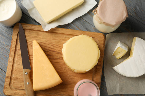 istock Different fresh dairy products on gray wooden background 1299749377