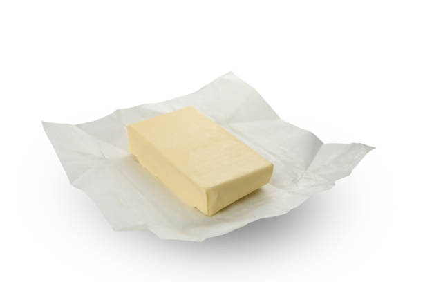 istock Paper with butter isolated on white background 1299749484