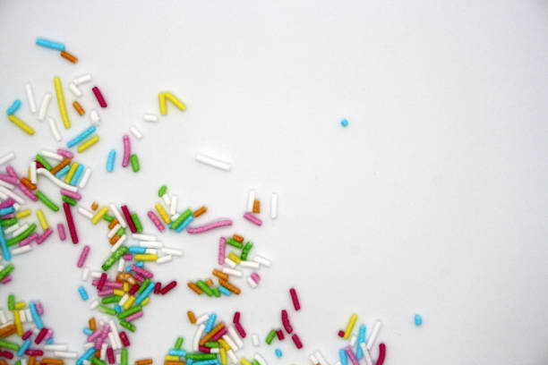 istock Colorful confectionery sprinkles on a white background. 1299749571