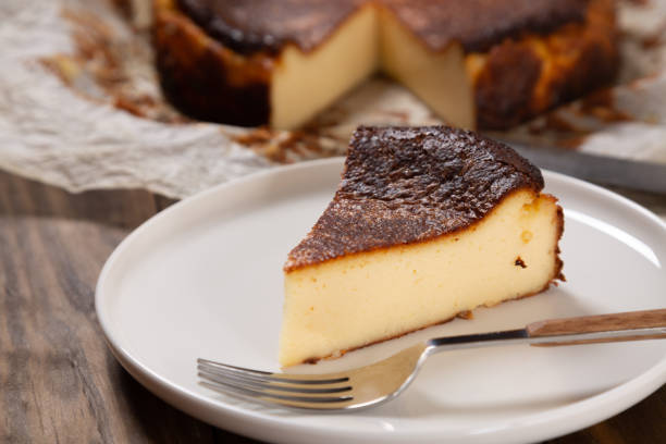 portion of the traditional basque burnt cheesecake - comunidade autónoma do país basco imagens e fotografias de stock