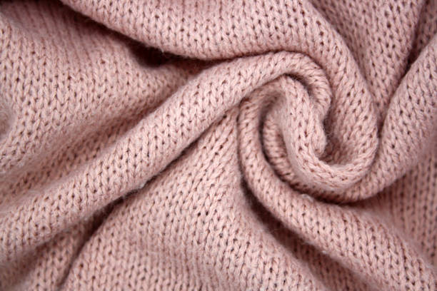 istock The background is made of synthetic fabric lying in waves. 1299749726