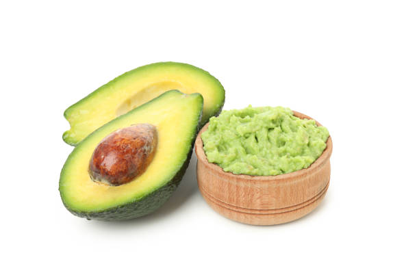 istock Bowl of guacamole and avocado isolated on white background 1299750573